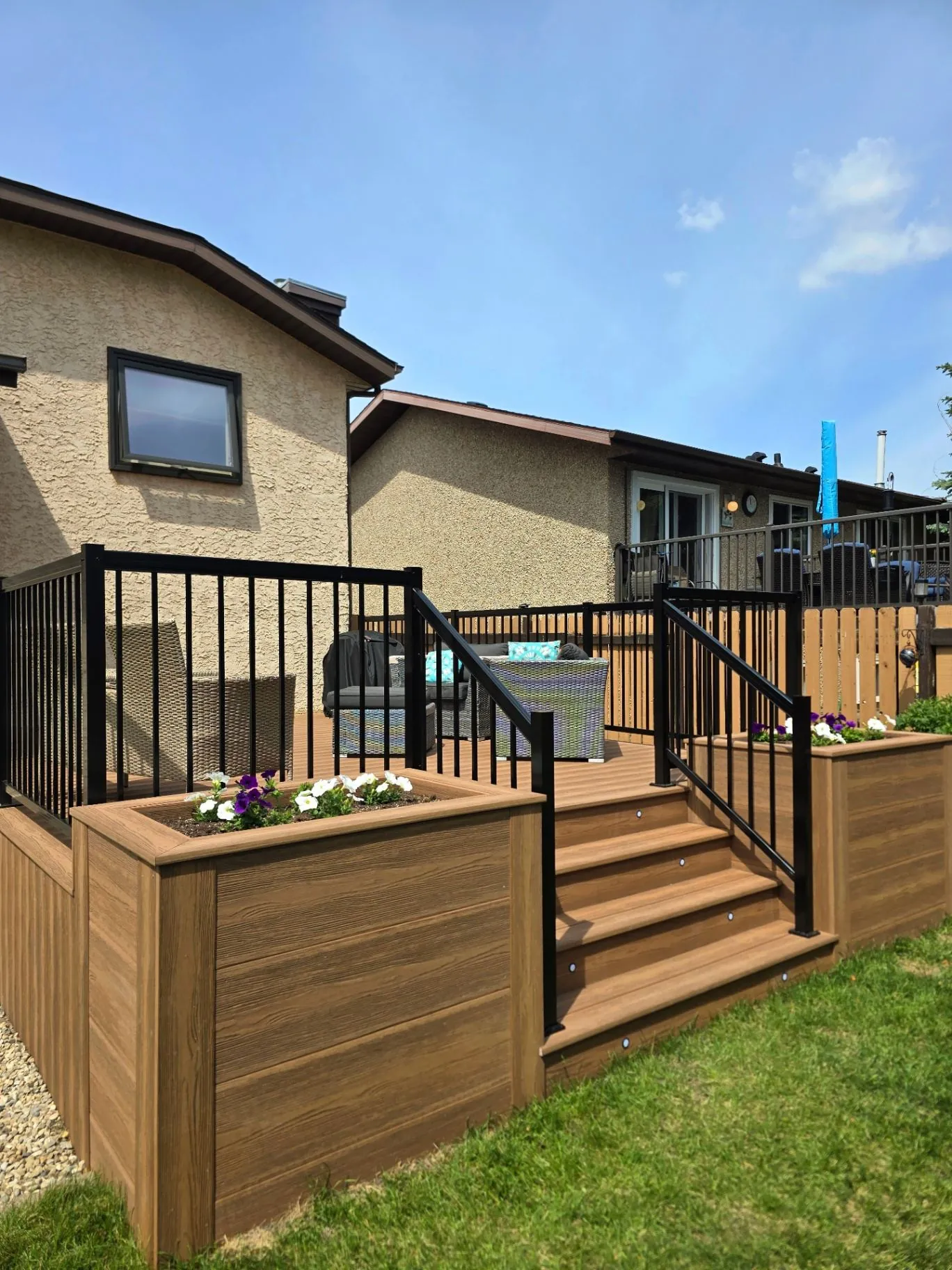 Eva-Last composite deck with planters & stair lighting — photo 2