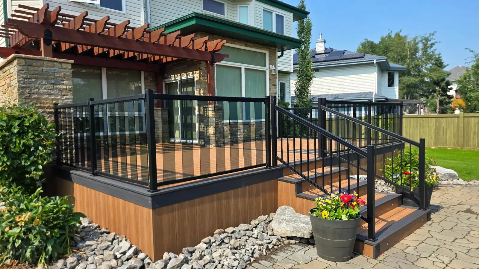 Two-tone Eva-Last deck with Celtic knot inlay and glass railing — photo 3