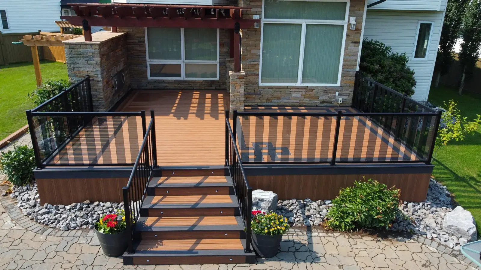Two-tone Eva-Last deck with Celtic knot inlay and glass railing — photo 6