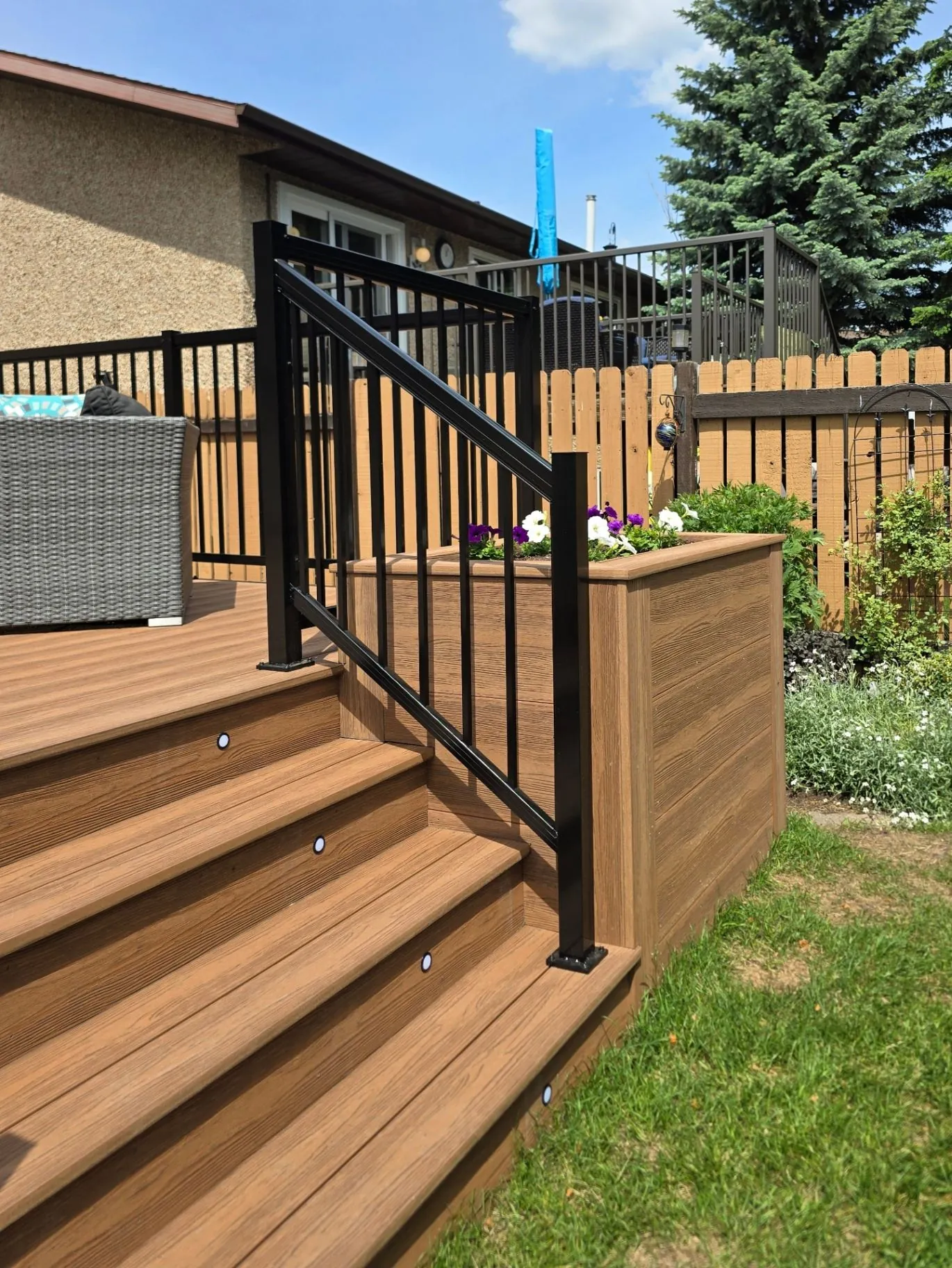 Eva-Last composite deck with planters & stair lighting — photo 4